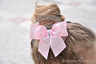 Hairstyle with a girl bow Stock Photo