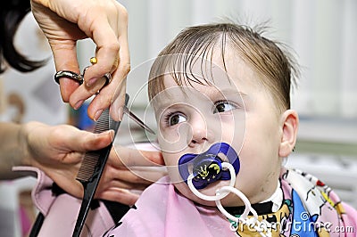 Hairstyle of the one year old child first time Stock Photo