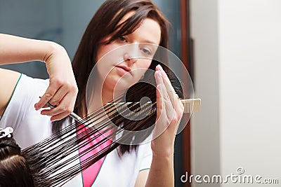 Hairstylist cutting hair woman client in hairdressing beauty salon Stock Photo