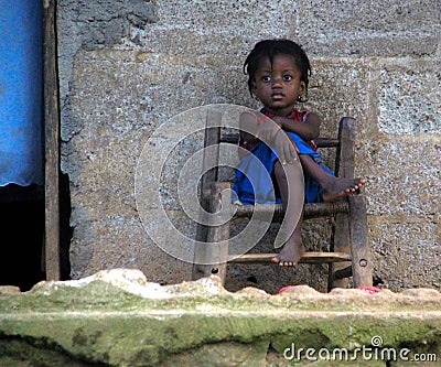 Haitian Young Girl on Porch Editorial Stock Photo