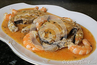 Hake fillets in prawns sauce a fish dish