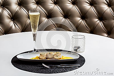 Hake medallions with champagne glass Stock Photo