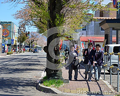 Highschool students playing on a sunny street Editorial Stock Photo