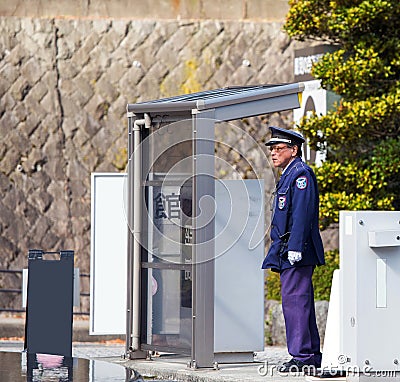 HAKONE, JAPAN - NOVEMBER 5, 2017: Policeman at the bus stop. Frame for text. Editorial Stock Photo