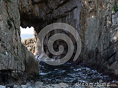 Hakusan Domon natural arch on cape Ashizuri Stock Photo