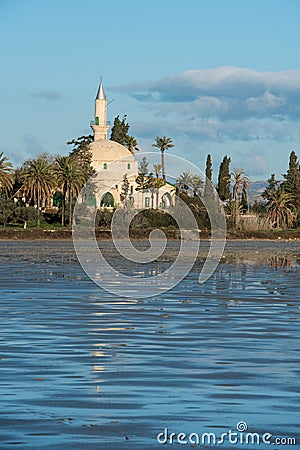 Hala Sultan Tekke or Mosque of Umm Haram religious muslim shrine at Larnaca Salt Lake in Cyprus. Stock Photo