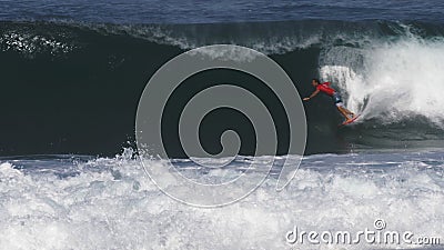 HALEIWA, UNITED STATES OF AMERICA - DECEMBER, 7, 2017: surfer getting a backdoor barrel at pipeline Editorial Stock Photo