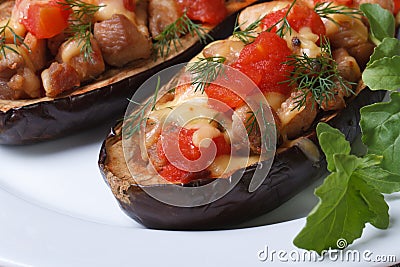 Half baked aubergine with meat, cheese and tomatoes Stock Photo