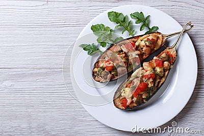 Half baked eggplants with meat, cheese and tomatoes Stock Photo