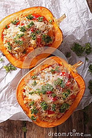 Half baked pumpkin with couscous, meat, vegetables and cheese Stock Photo