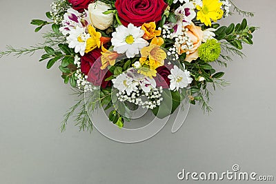 Half of a bouquet of flowers is isolated on a gray background Stock Photo