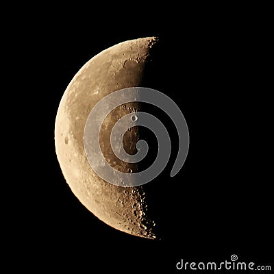 Half disk of the moon on a black sky background isolated, square aspect ratio Stock Photo