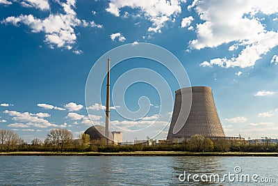 A half-dismantled nuclear atomic chimney against a blue sky with clouds in Mulheim-Karlich in western Germany, on the Rhine river. Stock Photo