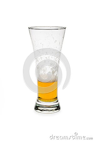 Half Empty Beer In a Pilsner Glass Stock Photo