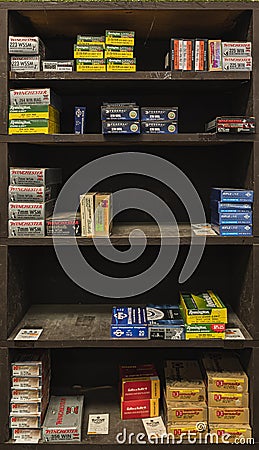 Half empty shelves with rifle ammo boxes at a gun shop, ammunition shortage in California, USA Editorial Stock Photo