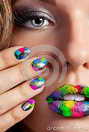 Girl with beautiful multicolor Minx nails and make-up Stock Photo