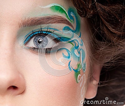 Half face portrait of sprite girl with faceart Stock Photo