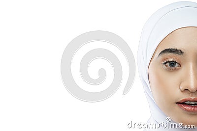 half face potrait of beautiful hijab woman wearing white veil with smiling Stock Photo