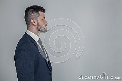 Half-faced profile side view close up portrait of serious focused handsome attractive style stylish modern masculine guy with Stock Photo