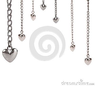 Half frame from small steel hearts and long chains on white Stock Photo