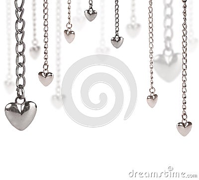 Half frame from steel hearts and long chains on white Stock Photo