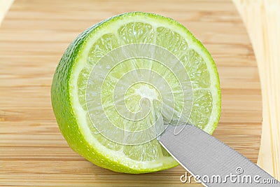 Half Green Lime Fruit Knife Cutting Board Stock Photo