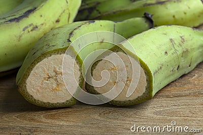 Half green unripe bananas Stock Photo