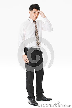 Half-length portrait of middle aged, handsome, Asian, businessman, in white shirt, striped tie.suffer from acute migraine, grimace Stock Photo