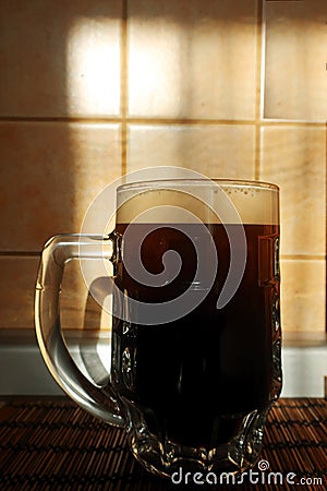 A half liter mug of dark beer Stock Photo