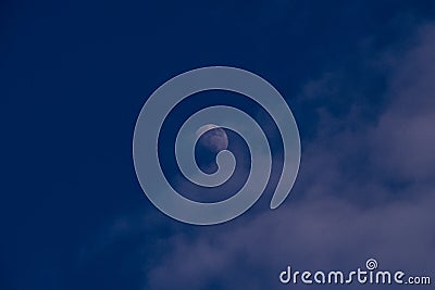 Half moon, blue sky Stock Photo