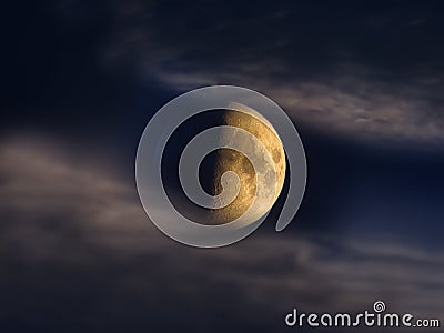 Half moon seen through night clouds on dark sky Stock Photo