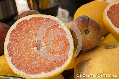 Half orange close-up. Peach beside Stock Photo