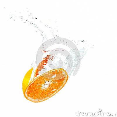 Half an orange falling into water Stock Photo