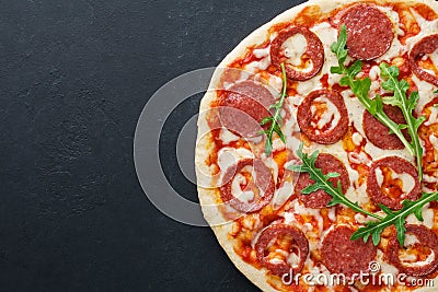 Half of pizza with heart shaped pepperoni for Valentines Day. Stock Photo