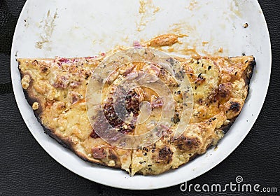 Half pizza in a plate Stock Photo