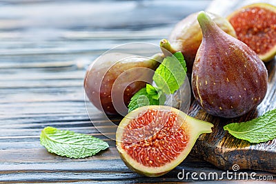 Half ripe sweet figs and whole fruits. Stock Photo