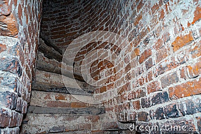 Half-ruined stairs in the ancient tower. Stairs in the ruined tower Stock Photo