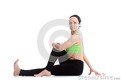 Half Spinal Twist yoga pose Stock Photo