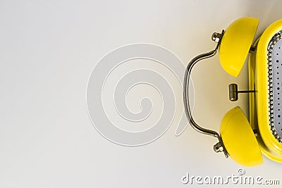 Half,top view of yellow color,vintage alarm clock on white Stock Photo