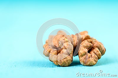 Half Walnut Kernel On Blue Stock Photo