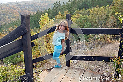 4 and a half year old girl makes funny face in a forest Stock Photo