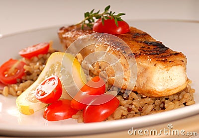 Halibut seared on a bed of brown rice Stock Photo