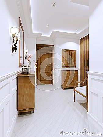 Hall entrance hall in a modern apartment in a classic style, with a chest of drawers and wall panels in white Stock Photo