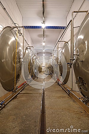 Hall with large metal tanks for fermenting beer Stock Photo