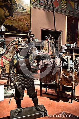 Hall with mannequins, covered with ancient armor, in the historic Stibbert villa in Florence. Editorial Stock Photo