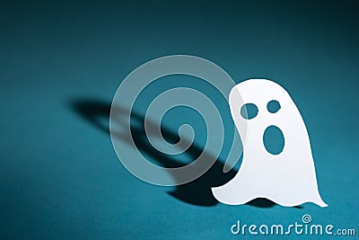 Halloween background concept. Cut out paper ghost and graphic sh Stock Photo