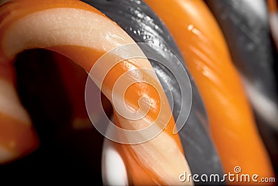 Halloween candies: black and orange candy canes Stock Photo