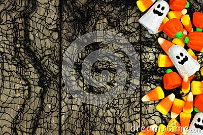 Halloween candy side border against spooky black background Stock Photo