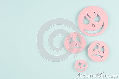 Halloween cartoon mock up for advertising, design, cover - pink paper emoji faces fly on pastel candy mint blue background. Stock Photo