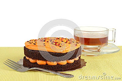 Halloween chocolate orange cake with tea Stock Photo